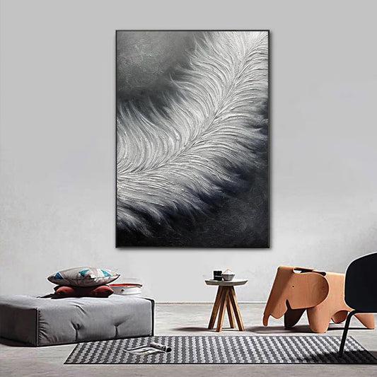 Abstract feather painting on a wall in a modern living room.
