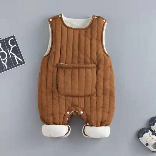 Brown quilted baby romper with white trim on a gray background