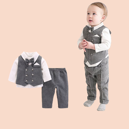 Baby boy in formal outfit with matching set on a beige background