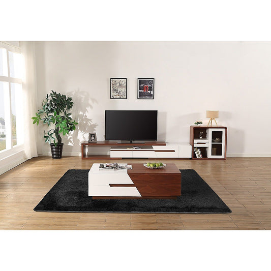 Modern living room with a TV stand, coffee table, and decorative items.