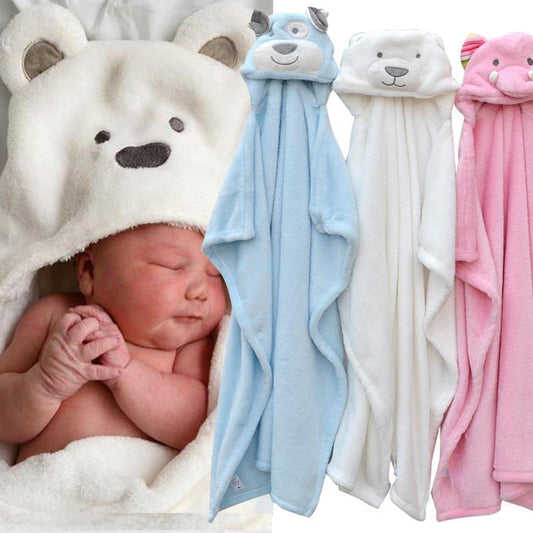 Newborn baby wrapped in a white bear hooded towel with blue, white, and pink towel options displayed.