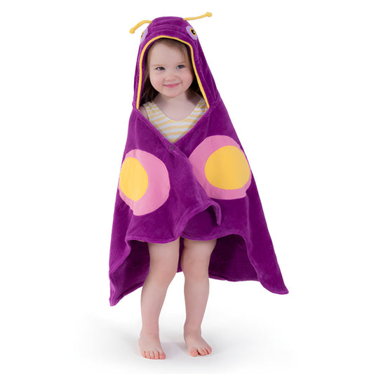 Child wearing a purple hooded towel with cartoon face design on a white background