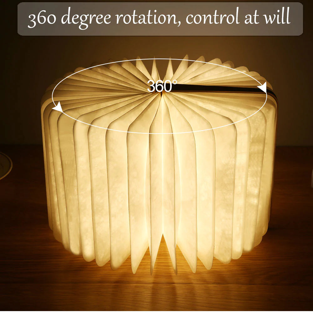 Foldable lamp with 360-degree rotation feature on a dark background